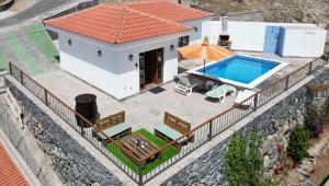 an aerial view of a house with a swimming pool at Arbinfo Casa Rural in Guía de Isora