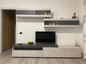 a living room with a flat screen tv on a tv stand at MPM - Apartment Balzarotti- Rho Fiera 4 pax in Rho