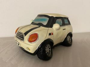 a small white toy car sitting on a table at MPM - Apartment Balzarotti- Rho Fiera 4 pax in Rho