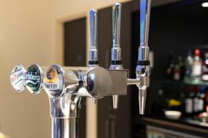 a close up of a faucet in a bar at Holiday Inn Express Manchester City Centre Arena by IHG in Manchester