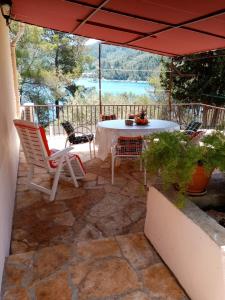 Balkón nebo terasa v ubytování Seafront Apartment Dana