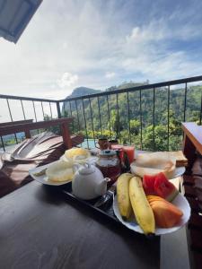 a tray of breakfast foods on a table with a view at Country Homes in Ella