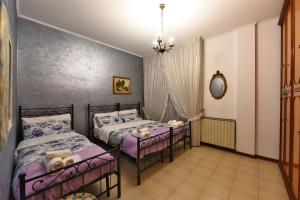 Postel nebo postele na pokoji v ubytování Fronte Fiera Apartment