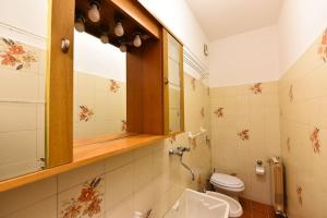 Koupelna v ubytování Fronte Fiera Apartment + 21 fotografií