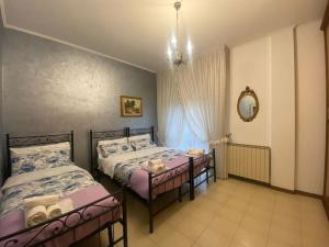 Postel nebo postele na pokoji v ubytování Fronte Fiera Apartment