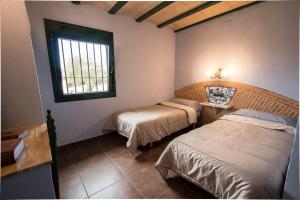 Postel nebo postele na pokoji v ubytování Catalunya Casas Your own private estate just 20km from Salou!
