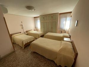 Postel nebo postele na pokoji v ubytování Casa Caburlotto + 37 fotografií