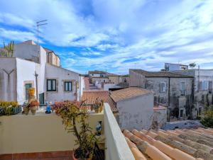 a view of a city from the roof of a building at La Casa Delle Fate in Siracusa