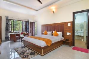 a bedroom with a large bed in a room at LA Riqueza Dhanolti View # Mountain View Rooms # Parking # Lift # Near to Eco Park & Surkanda Devi Temple in Dhanaulti