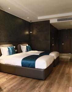 Ein Bett oder Betten in einem Zimmer der Unterkunft Sofia International Hotel
