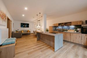 an open kitchen and living room in a house at FEWO Immenstadt in Immenstadt im Allgäu