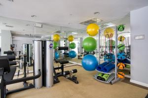 a gym with exercise equipment and balls on the walls at Santa Clara 3BR w Gym Pool WD nr highways SFO-463 in Santa Clara