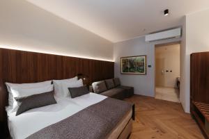 Rúm í herbergi á Hotel Švicarija - Terme Dobrna