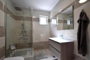 a bathroom with a shower and a toilet and a sink at Apartment Lana in Soline