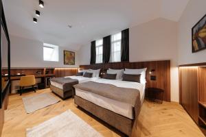 Rúm í herbergi á Hotel Švicarija - Terme Dobrna
