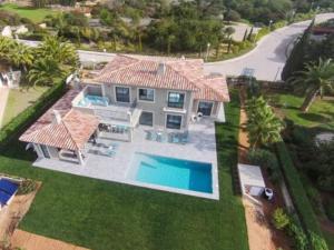 an aerial view of a house with a swimming pool at Luxurious Algarve Villa Villa Manou 5 Bedrooms Private Heated pool 300m from the Beach Carvoeiro in Carvoeiro