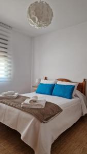Postel nebo postele na pokoji v ubytování Apartamento Baeza Cózar 1