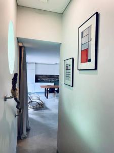 a room with a hallway with a table and a door at Designer Studio in Sydney