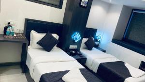 Postel nebo postele na pokoji v ubytování Hotel Larmont Luxury