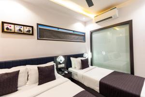 Postel nebo postele na pokoji v ubytování Hotel Larmont Luxury
