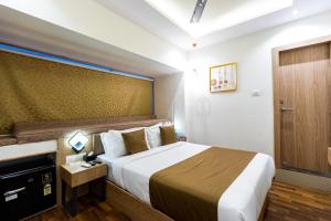 Postel nebo postele na pokoji v ubytování Hotel Larmont Luxury