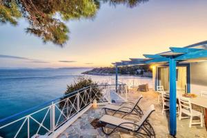 a villa with a view of the ocean at Villa Nikolitsa with private beach in Megara