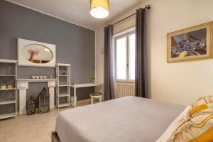 Rúm í herbergi á Affittacamere da Marianna