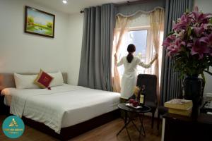 Postel nebo postele na pokoji v ubytování Hanoi Aria Central Hotel & Spa