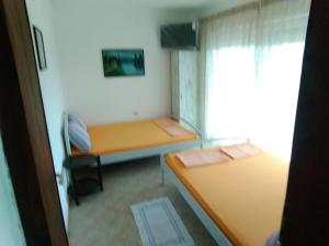 Postel nebo postele na pokoji v ubytování Apartmani Sofija