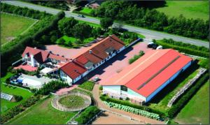 an aerial view of a house with a building at Assendrupgaard Vejle in Vejle