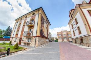 a building with a mural on the side of it at Hotel Fryderyk in Rzeszów