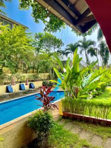 a swimming pool in front of a resort at Résidence Bertille Abidjan Cocody in Abidjan