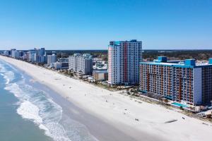 an aerial view of the beach and buildings at Landmark Resort 936 in Myrtle Beach