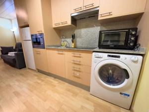 Kuchyň nebo kuchyňský kout v ubytování Apartamentos Princesa Park 3000