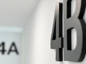 a close up of the number on a wall at Valencia Luxury - Calma Beach Apartments in Valencia