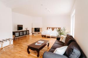 a living room with a couch and a table at Kaiser's Hof in Strass