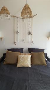 a bedroom with a bed with two pillows at Joli Studio cavalaire in Cavalaire-sur-Mer
