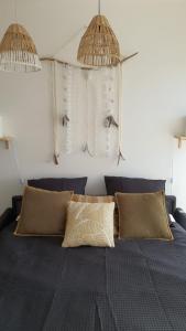 A bed or beds in a room at Joli Studio cavalaire