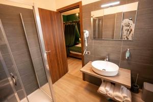 a bathroom with a sink and a shower at Binario Magic RistoHotel in Palazzago +92 photos