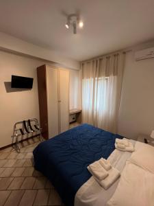 Кровать или кровати в номере Villa Gianna