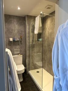 a bathroom with a shower and a toilet at The Acarsaid - Pitlochry in Pitlochry +71 photos