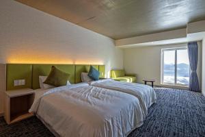 HOTEL COCOA RESORT客房内的一张或多张床位