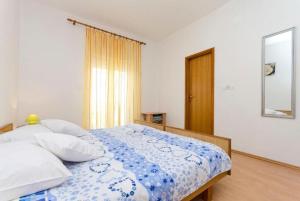Postel nebo postele na pokoji v ubytování Apartments Anastazija