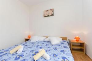 Postel nebo postele na pokoji v ubytování Apartments Anastazija