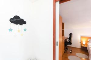 a bedroom with a black cloud on the wall at Apartment Marija in Vodice +26 photos