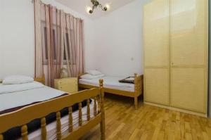 Postel nebo postele na pokoji v ubytování Apartments Nada