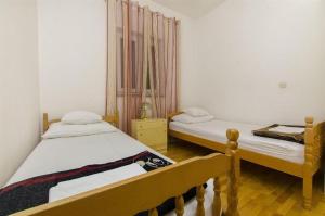 Postel nebo postele na pokoji v ubytování Apartments Nada