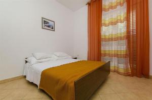 Postel nebo postele na pokoji v ubytování Apartments Nada