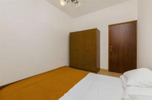 Postel nebo postele na pokoji v ubytování Apartments Nada