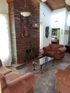 a living room with a couch and chairs and a table at 15 President Street in Parys in Parys